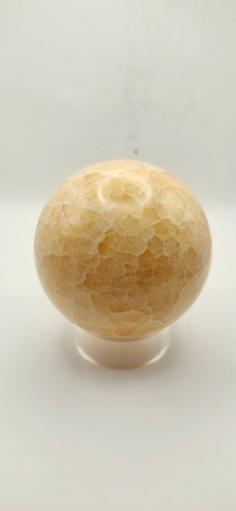 Orange calcite sphere. 72mm, 2.83 inches, 1.3 pounds!