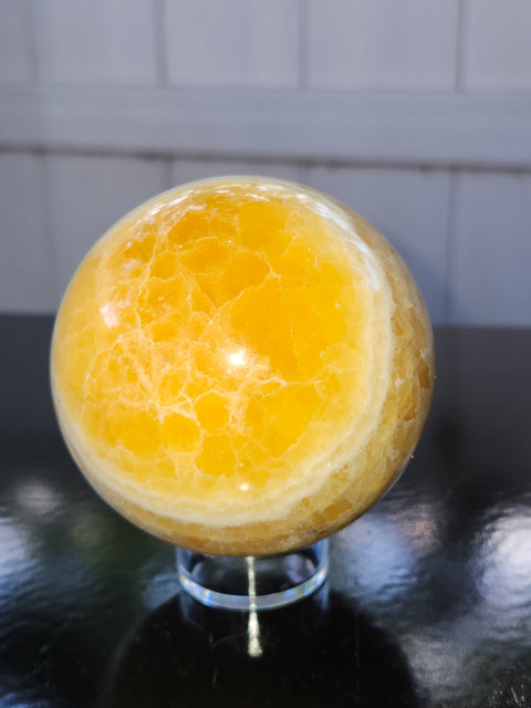Orange calcite sphere! 73.6mm, 2.9 inches, 1.4 pounds