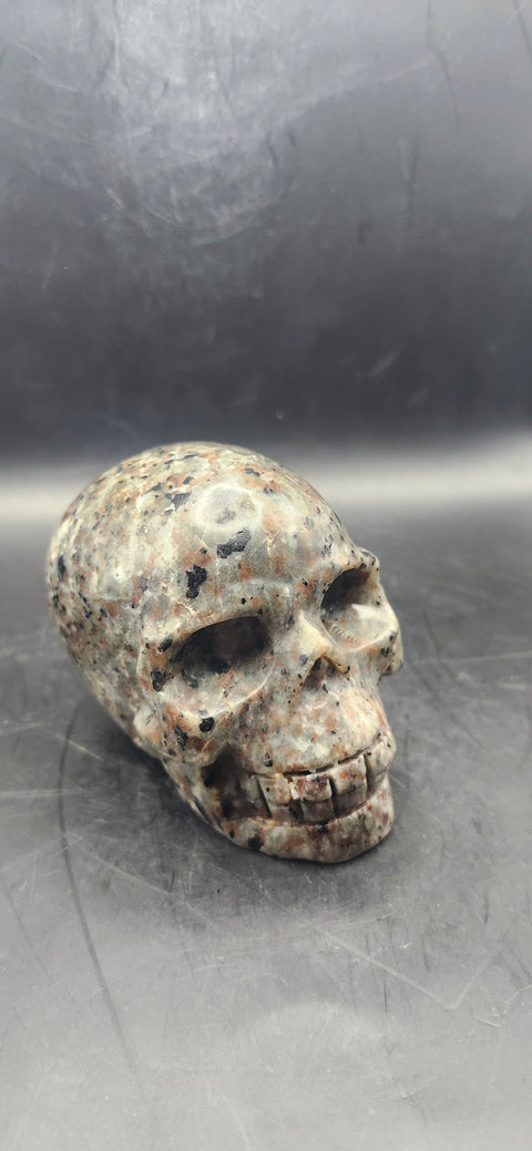 Flame stone "yooperlite" skull! 3 inchs tall, 3 long, 14 ounces