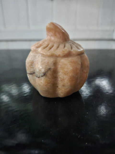 Orange calcite pumpkin. 9 ounces, 3 inches tall