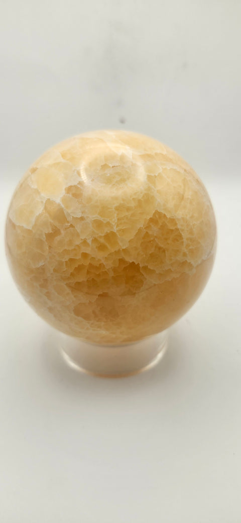 Orange calcite sphere. 72mm, 2.83 inches, 1.3 pounds!