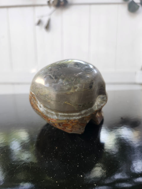 Fruit jasper skull, 1.3 pounds, 3.75 inches long, 3 inches tall, 2.5 inches wide