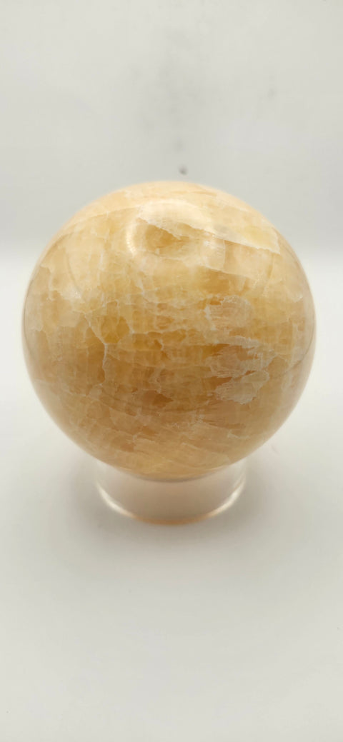 Orange calcite sphere. 72mm, 2.83 inches, 1.3 pounds!