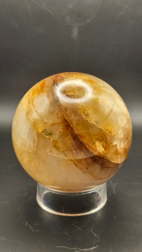 Ferruginous quartz sphere. 71.6mm, 2.82 inches, 1.2 pounds