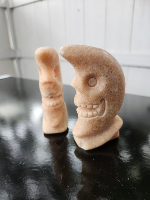 7.4 ounce orange calcite skull faced moon carving! 4 inches