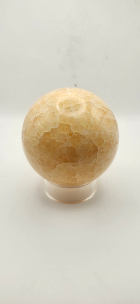 Orange calcite sphere. 72mm, 2.83 inches, 1.3 pounds!