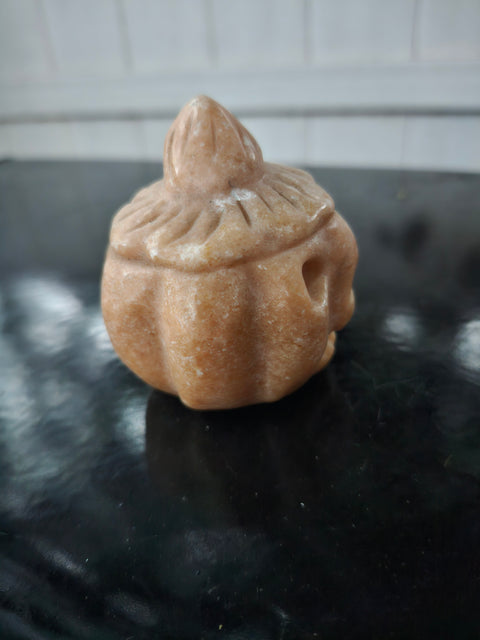 Orange calcite pumpkin. 9 ounces, 3 inches tall