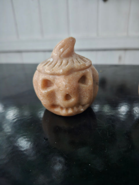 Orange calcite pumpkin. 9 ounces, 3 inches tall
