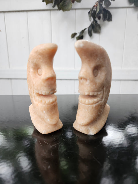 7.4 ounce orange calcite skull faced moon carving! 4 inches