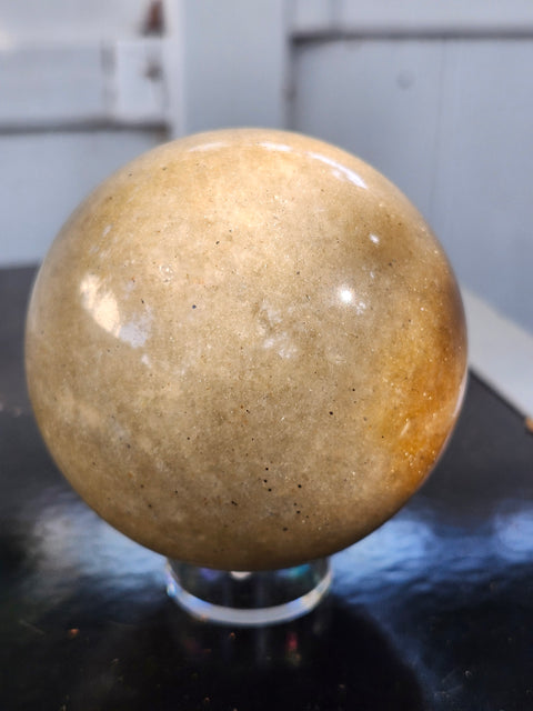 Green and gold aventurine sphere with silver flash 1.4 pounds, 74mm