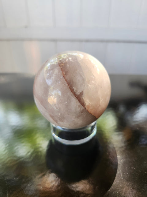 13 ounce, 64mm, 2.52 inch ferruginous quartz sphere