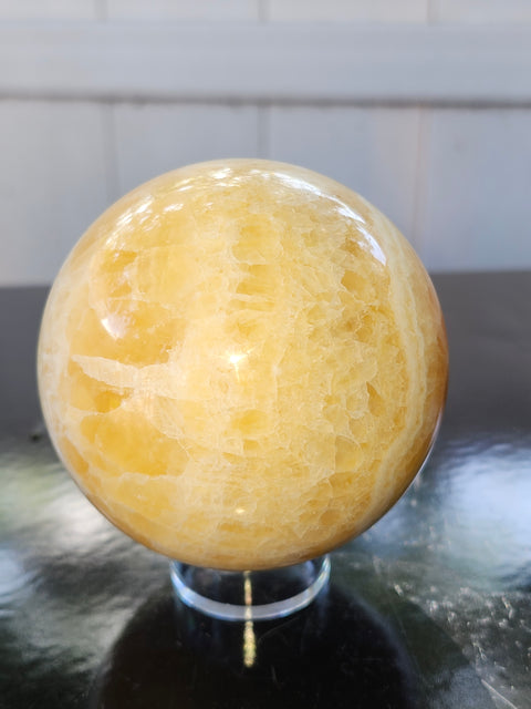 Orange calcite sphere! 73.6mm, 2.9 inches, 1.4 pounds