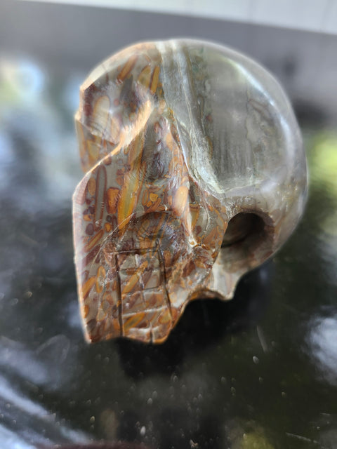 Fruit jasper skull, 1.3 pounds, 3.75 inches long, 3 inches tall, 2.5 inches wide