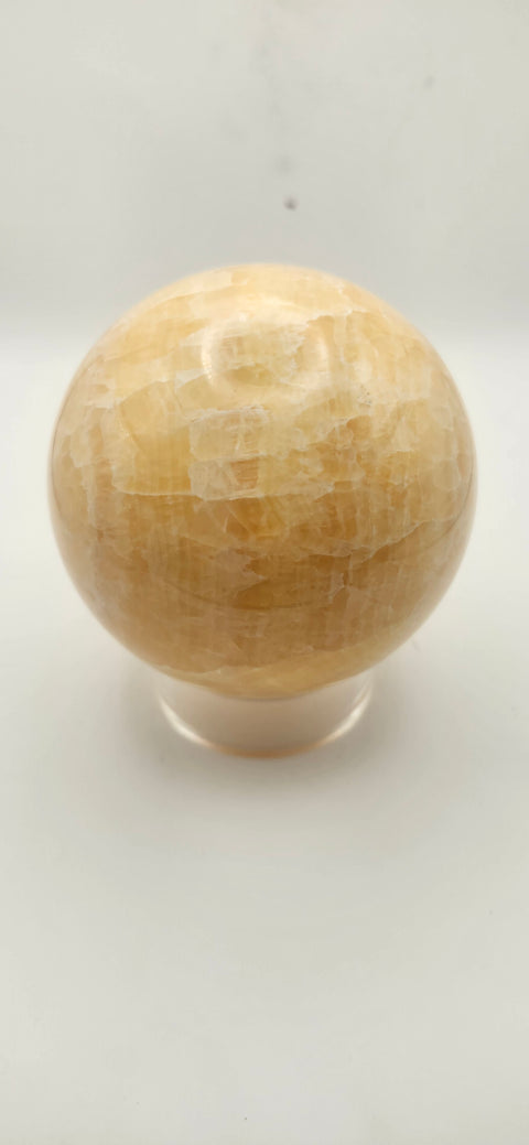 Orange calcite sphere. 72mm, 2.83 inches, 1.3 pounds!