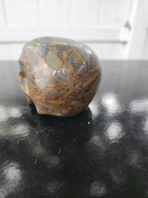 Fruit jasper skull. 15 ounces, 3.5 inches wide, 2.75 inches long