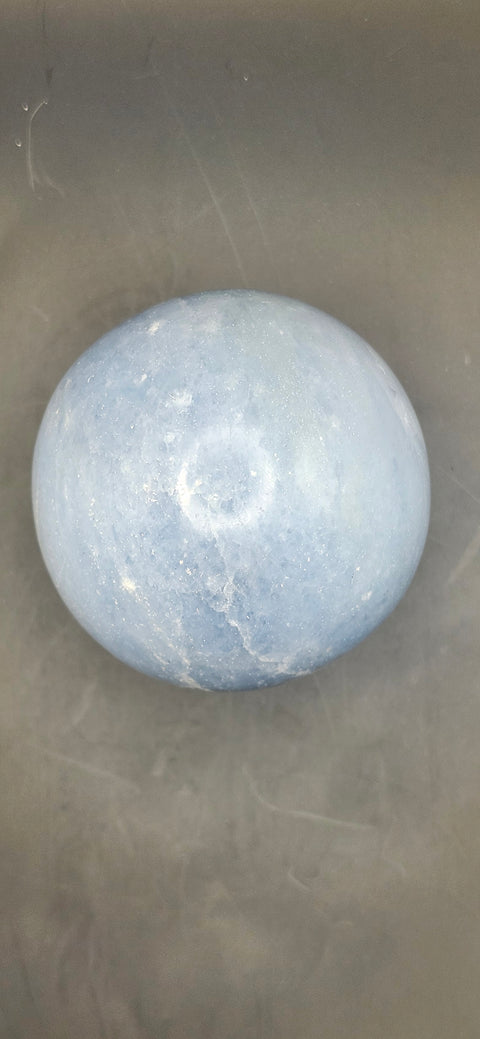 Blue calcite sphere. 62mm, 2.44 inches, 12 ounces