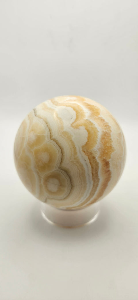 Orange calcite sphere. 72.5mm, 2.85 inches, 1.3 pounds