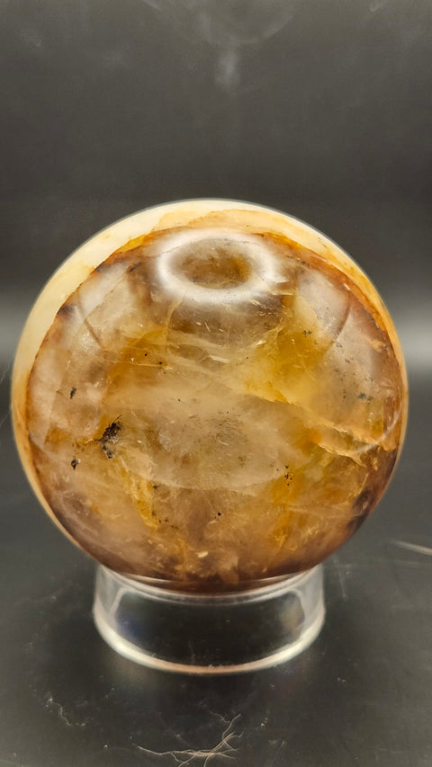 Ferruginous quartz sphere. 71.6mm, 2.82 inches, 1.2 pounds