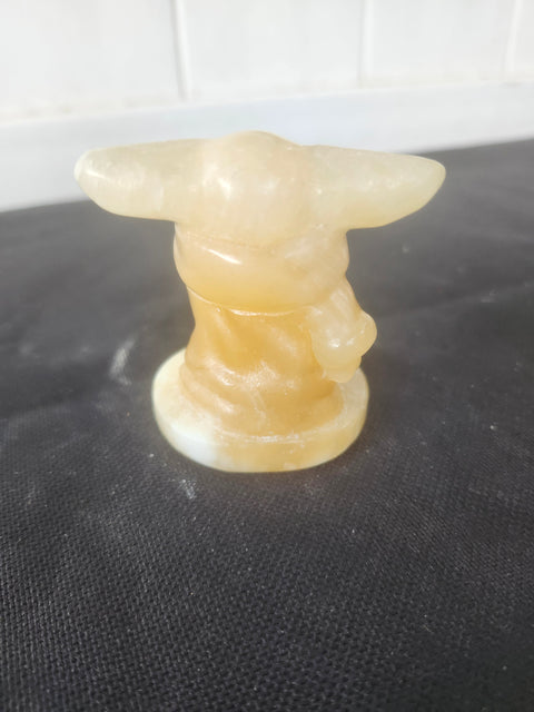 4.4 ounce, 2.75 inch orange calcite yoda
