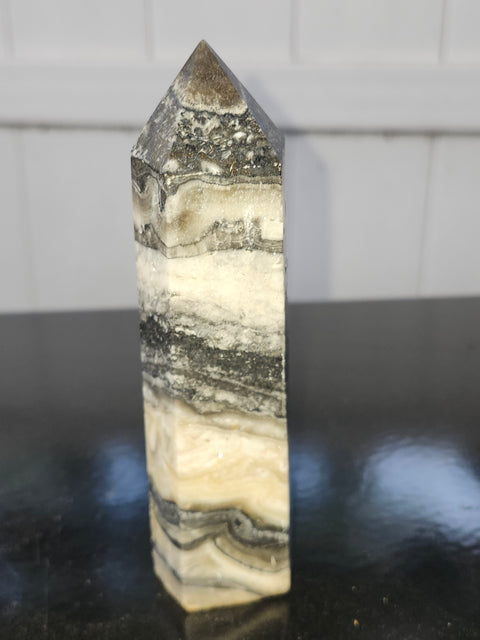Striped calcite tower! 5.1 inches tall, 10 ounces