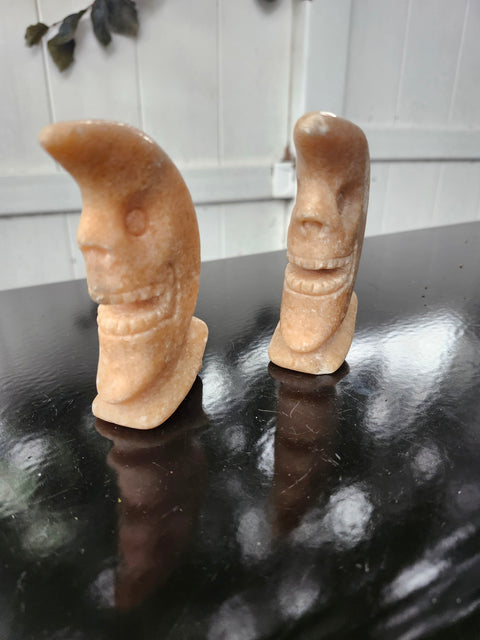 7.4 ounce orange calcite skull faced moon carving! 4 inches