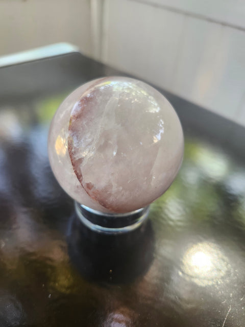 13 ounce, 64mm, 2.52 inch ferruginous quartz sphere