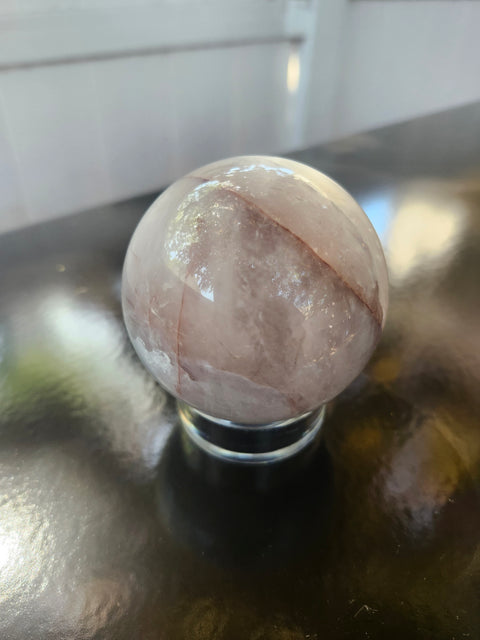 13 ounce, 64mm, 2.52 inch ferruginous quartz sphere
