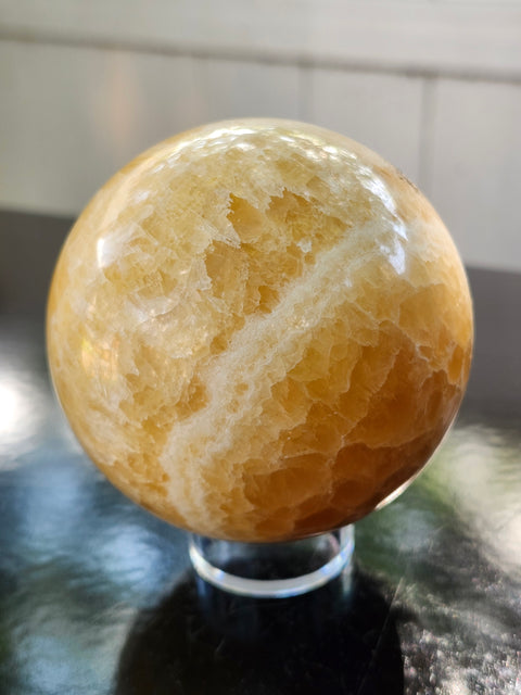 Orange calcite sphere! 73.6mm, 2.9 inches, 1.4 pounds