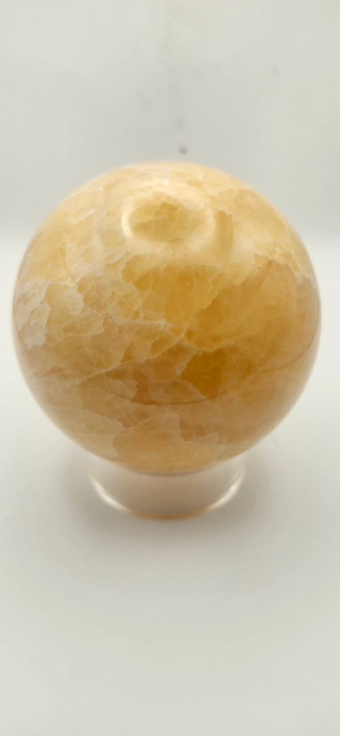 Orange calcite sphere. 72mm, 2.83 inches, 1.3 pounds!