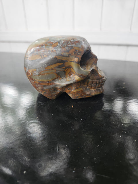 Fruit jasper skull. 15 ounces, 3.5 inches wide, 2.75 inches long