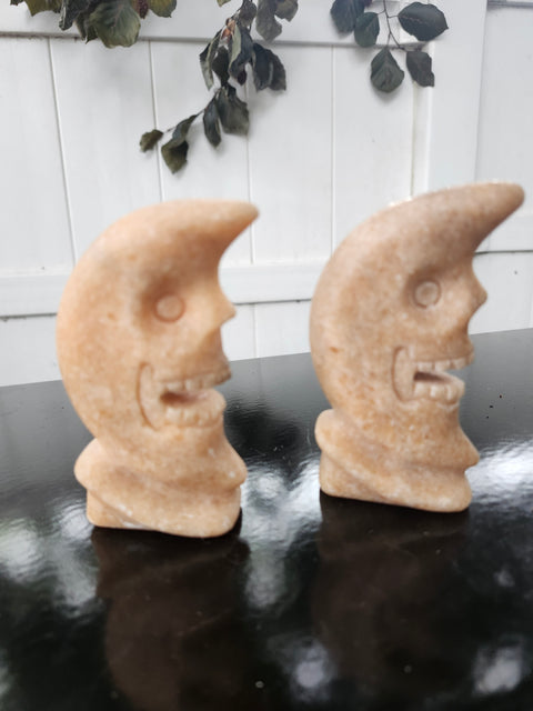 7.4 ounce orange calcite skull faced moon carving! 4 inches