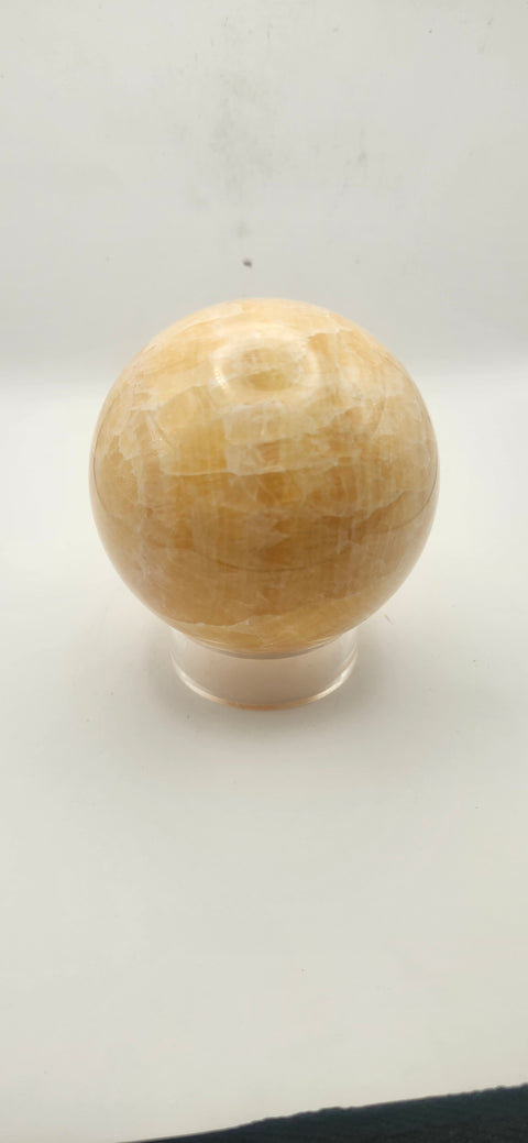 Orange calcite sphere. 72mm, 2.83 inches, 1.3 pounds!