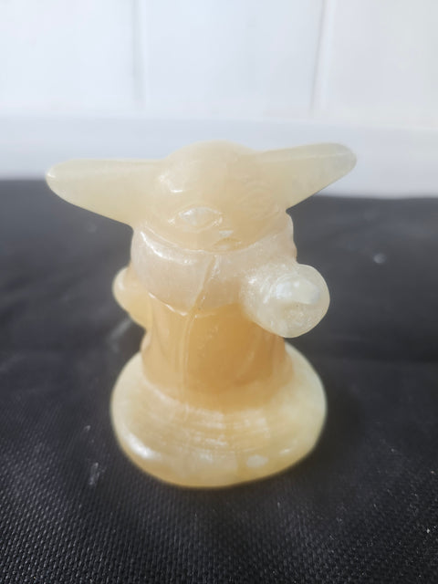 4.4 ounce, 2.75 inch orange calcite yoda
