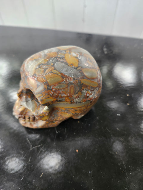 Fruit jasper skull. 15 ounces, 3.5 inches wide, 2.75 inches long