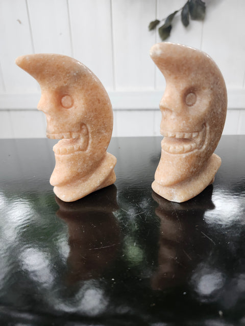 7.4 ounce orange calcite skull faced moon carving! 4 inches