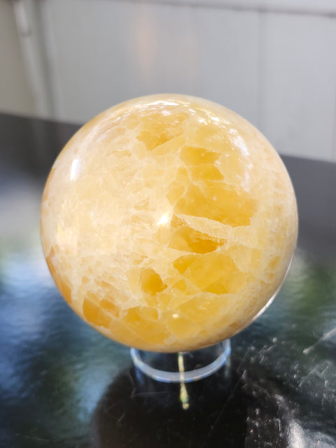 Orange calcite sphere! 73.6mm, 2.9 inches, 1.4 pounds