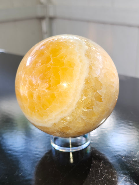 Orange calcite sphere! 73.6mm, 2.9 inches, 1.4 pounds