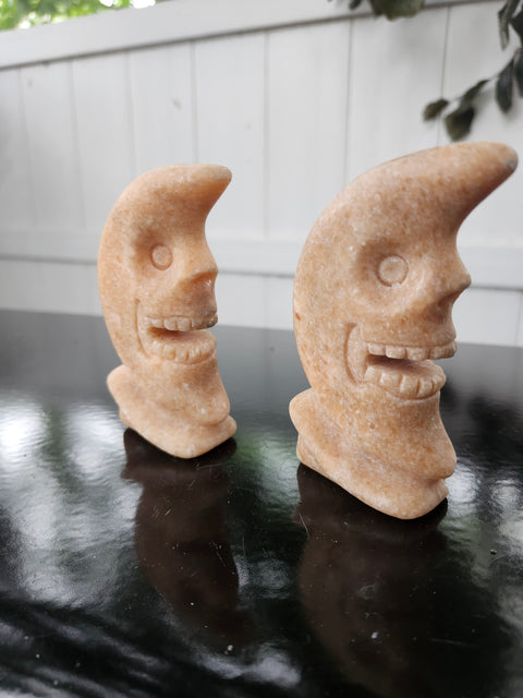 7.4 ounce orange calcite skull faced moon carving! 4 inches