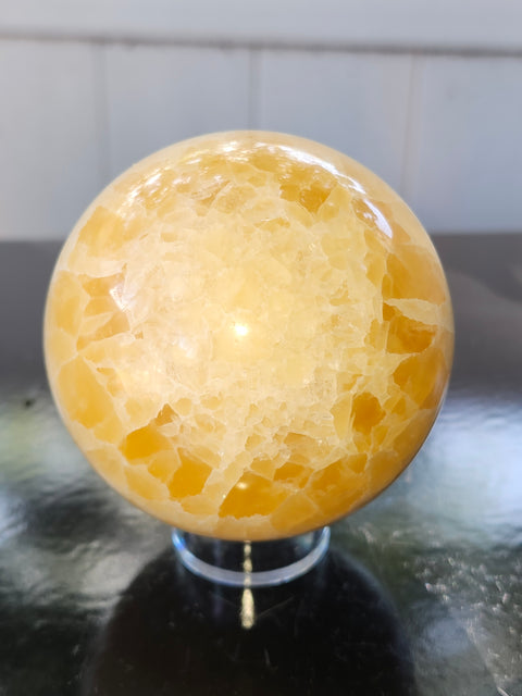 Orange calcite sphere! 73.6mm, 2.9 inches, 1.4 pounds
