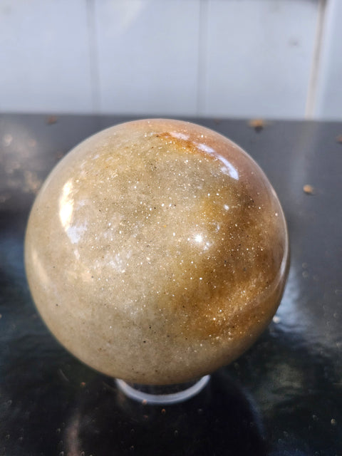 Green and gold aventurine sphere with silver flash 1.4 pounds, 74mm