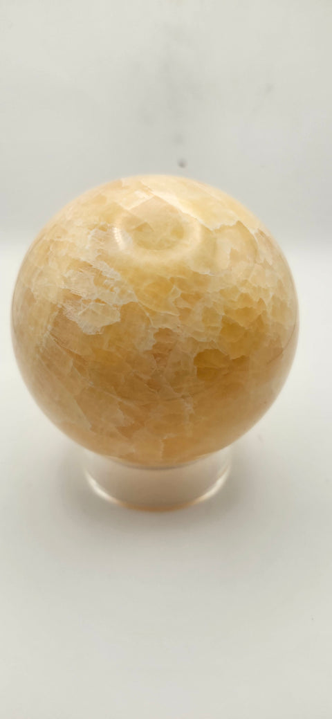 Orange calcite sphere. 72mm, 2.83 inches, 1.3 pounds!