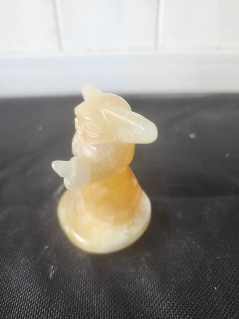 4.4 ounce, 2.75 inch orange calcite yoda
