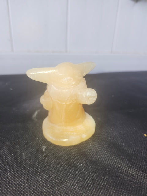 4.4 ounce, 2.75 inch orange calcite yoda