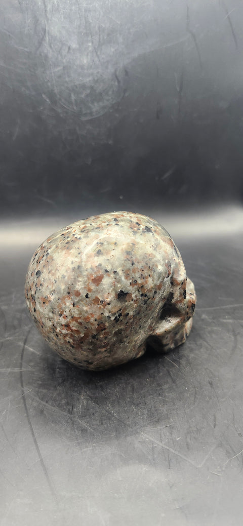 Flame stone "yooperlite" skull! 3 inchs tall, 3 long, 14 ounces