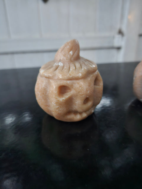 Orange calcite pumpkin. 9 ounces, 3 inches tall