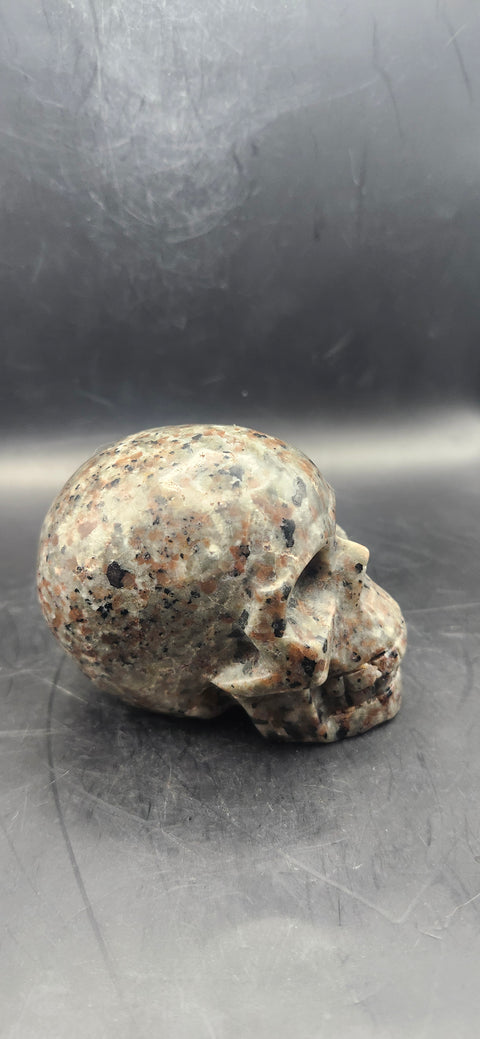 Flame stone "yooperlite" skull! 3 inchs tall, 3 long, 14 ounces