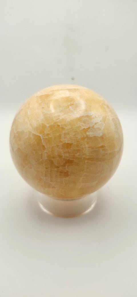 Orange calcite sphere. 72mm, 2.83 inches, 1.3 pounds!
