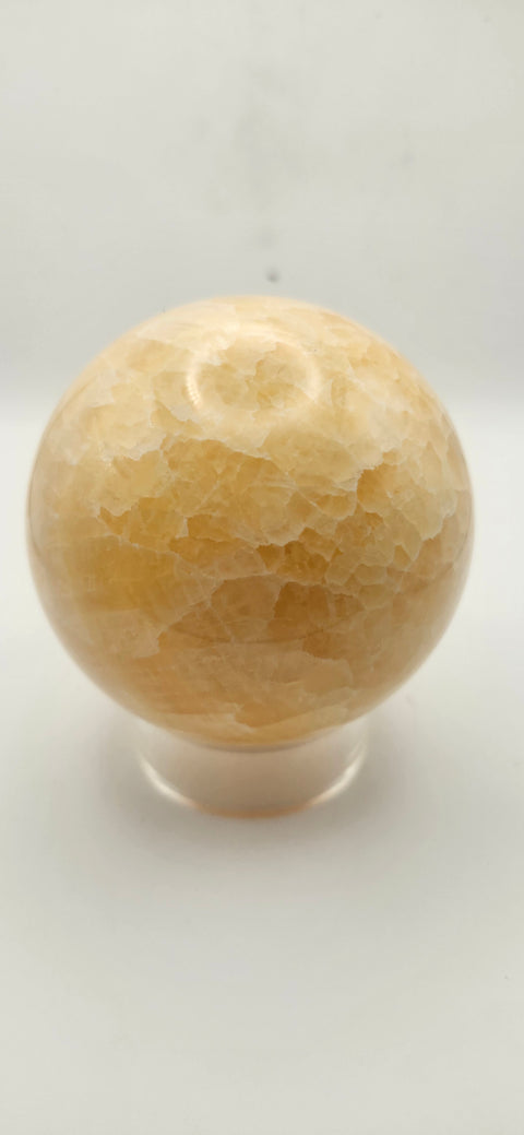Orange calcite sphere. 72mm, 2.83 inches, 1.3 pounds!