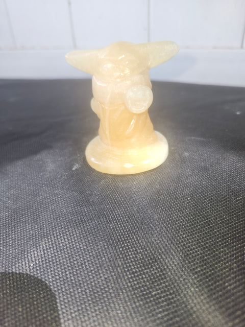 4.4 ounce, 2.75 inch orange calcite yoda