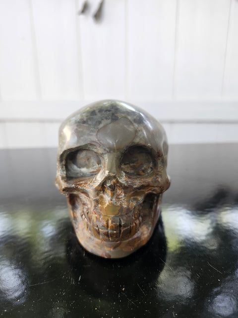 Fruit jasper skull, 1.3 pounds, 3.75 inches long, 3 inches tall, 2.5 inches wide